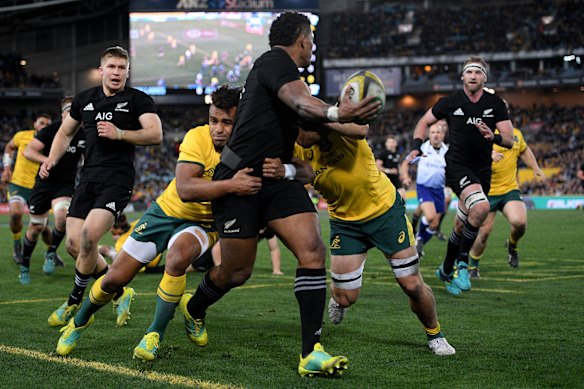 Fine line: Waisake Naholo offloads  in the lead-up to Aaron Smith's try just before half-time. 