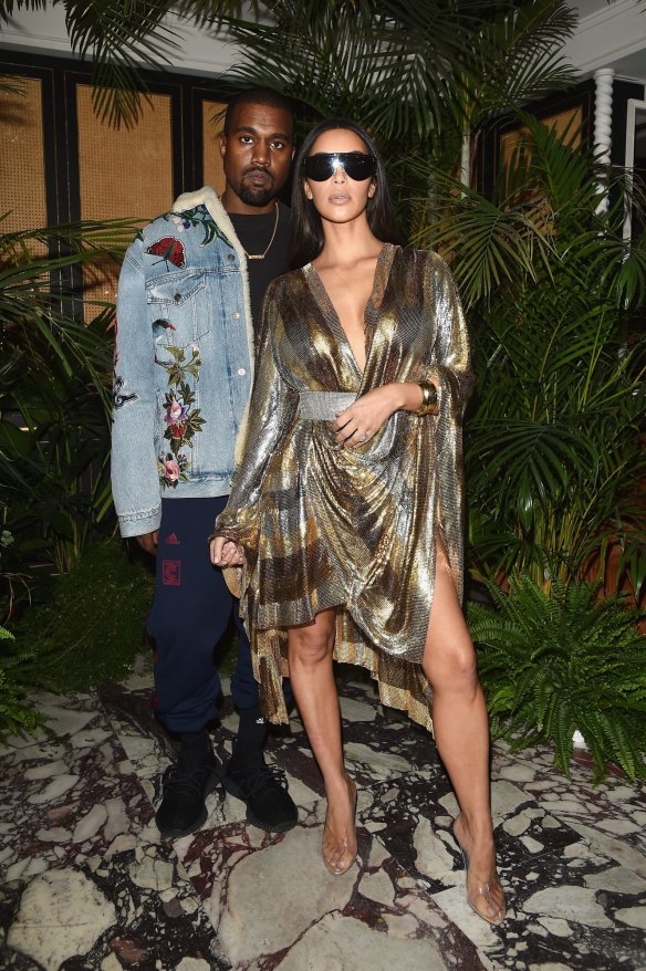 Kim Kardashian in Balmain, with Kanye West, in Paris. 
