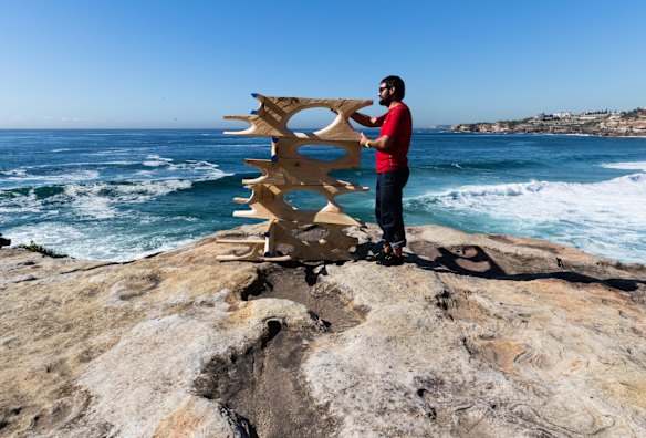 Maurizio Perron, installing his work, 'Filter', at Sculpture by the Sea, in Sydney.