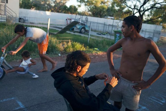 Locals prepare to go hunting and fishing for the evening.