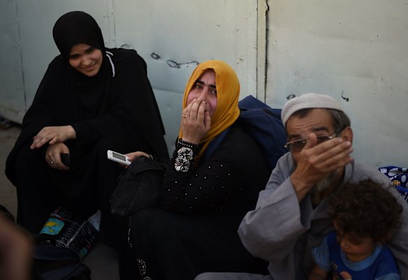 Emotional scenes moments after people have been rescued by Iraqi forces and arrive safely at a screening point in West Mosul.