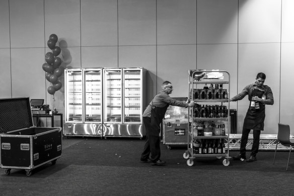 Staff pack away mountains of alcohol that had been ordered for Labor's planned celebration.