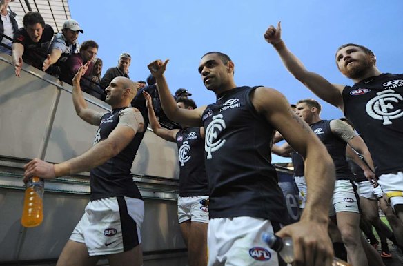 Carlton's Chris Judd, Chris Yarran and Zach Tuohy walk in after beating Richmond.