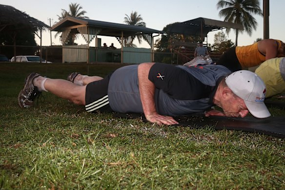 Prime Minister Tony Abbott doing physical training with members of the Bamaga community, during his visit to Cape York, on Friday 28 August 2015. Photo: Alex Ellinghausen