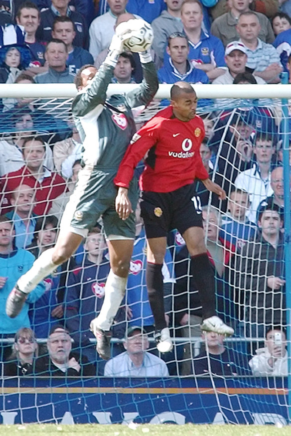 Shaka Hislop, left, takes the ball during a 2004 game between Portsmouth and Manchester United.