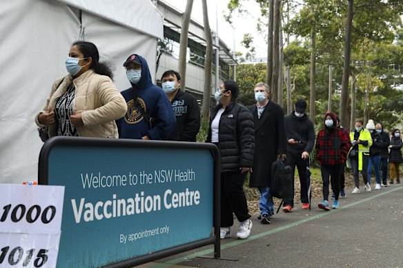 Long lines outside the COVID-19 vaccination centre at Olympic Park as COVID-19 lockdown stretches on across Greater Sydney.