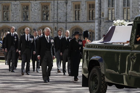 From front left, Britain's Prince Charles, Princess Anne, Prince Andrew. Prince Edward, Prince William, Peter Phillips, Prince Harry, Earl of Snowdon and Tim Laurence follow the coffin in a ceremonial procession for the funeral of Britain's Prince Philip inside Windsor Castle.
