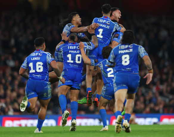 Samoa celebrates the win after Stephen Crichton’s field goal.