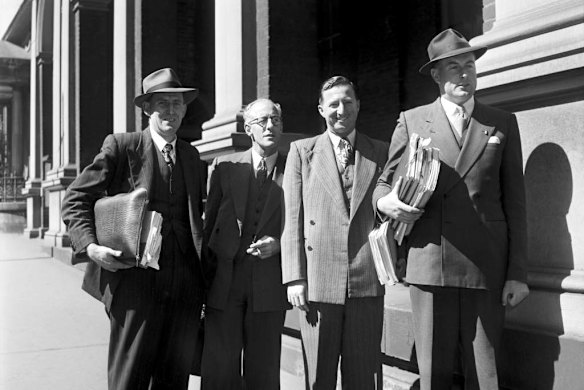 Mr White, Mr Arthur Beckhouse, an unidentified man and Mr E.G. Whitlam (assisting the Commissioner) attend the Liquor Royal Commission at the Supreme Court in Sydney on 2 September 1952.  SUN NEWS Picture by CARTY  Arthur George Beckhouse early Gough Whitlam 1950s NSW liquor laws liquor inquiry hearing staffers Australian black and white post war underworld organized crime historic hhollins licensing