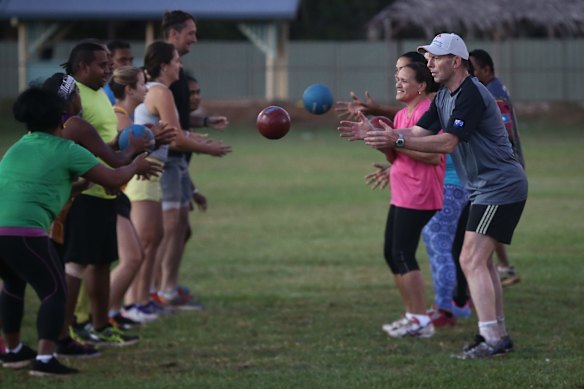Prime Minister Tony Abbott doing physical training with members of the Bamaga community, during his visit to Cape York, on Friday 28 August 2015.