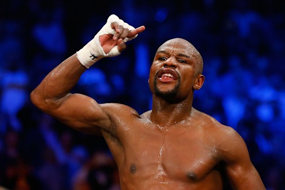 Floyd Mayweather Jr. reacts after the welterweight unification championship bout.