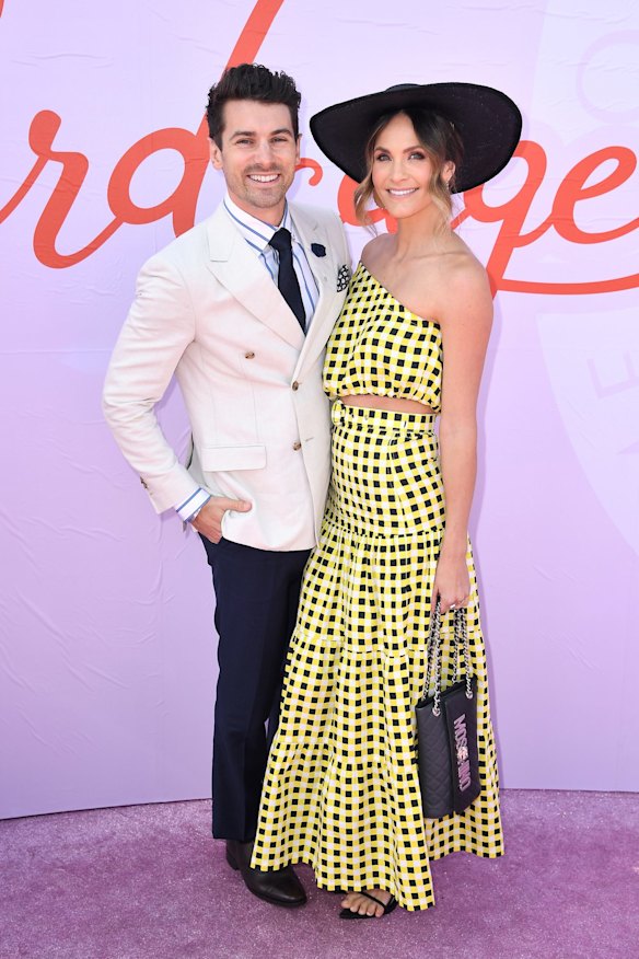 Matty Johnson and Laura Byrne attend Melbourne Cup Day at Flemington Racecourse.