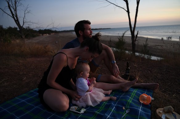Bethan and Johhny McElwee watch the sun set at Dripstone Cliffs in Darwin on Aviana's first birthday. 