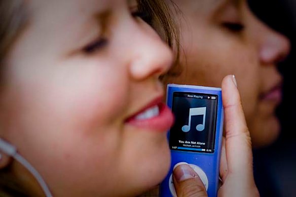 Lesley Gant and Yvonne Ordiz listen to Michael Jackson's music on an ipod outside the UCLA medical Center.