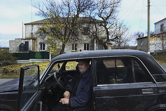 A local waits in his car at a World Central Kitchen food distribution point in Novooleksandrivka village in the Kherson Oblast. Locals in this area will only leave their homes to go collect groceries as they live in fear of Russian missile attacks.