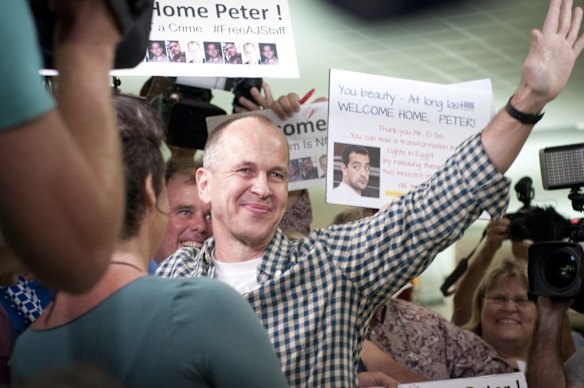 Greste greets his supportes.