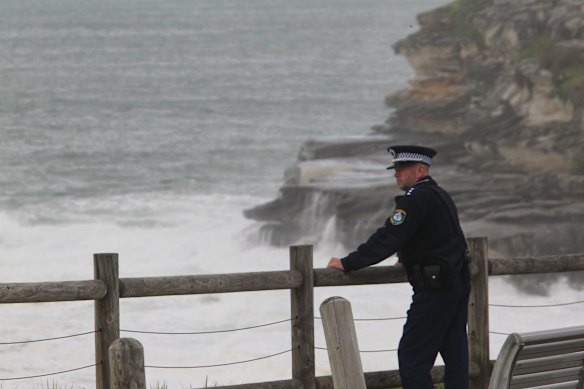 First light at Bondi as a Police Officer searches for a missing swimmer after he went missing yesterday.
