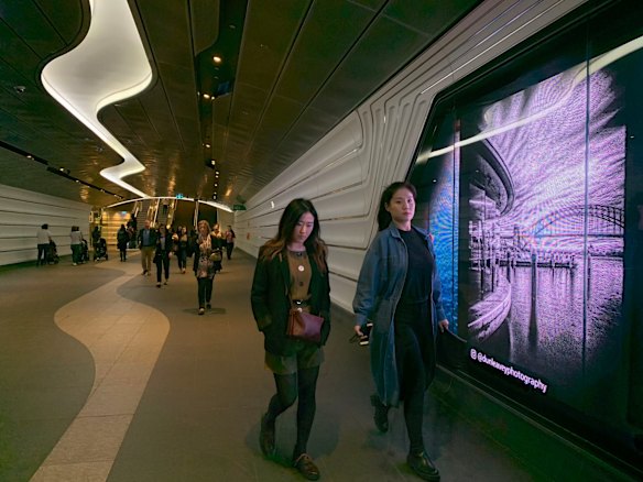 Commuters walk through the tunnel at Wynyard station, Sydney. This frame was taken with low light.
