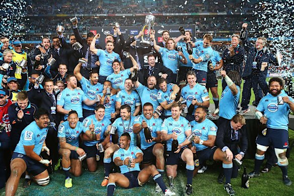 Champions: Waratahs players celebrate after winning the Super Rugby final over the Crusaders at ANZ Stadium.