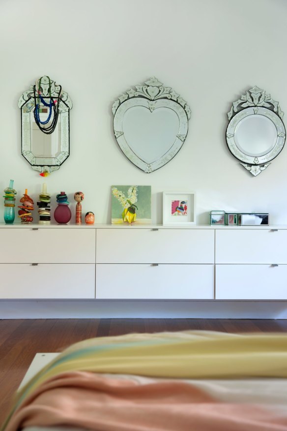 Decorative mirrors in the master bedroom are gifts from Rina’s husband, Mark. “He started buying them for me when we first moved in together, 20 years ago,” she says.