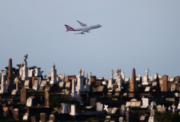 The last Qantas 747 passes over Waverley Cemetery as it departs Sydney on its final flight.