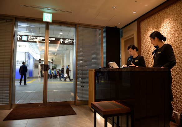 Employees stand at a reception counter of the View Gold Lounge, operated by East Japan Railway Company and View Card, at Tokyo Station in Tokyo, Japan. Starting Saturday 26 March 2016, Japan's bullet train Shinkansen rolls into the county's second-largest island Hokkaido for the first time. Passengers on the GranClass can check into this lounge at Tokyo Station before boarding.