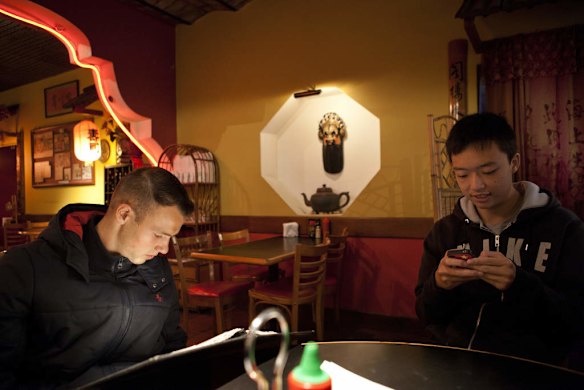 Gavin de Niese, left, with his friend and partner from Australia, Rudy Zhong Yi Qiu. Having lunch in Buenos Aires China Town, after training in River Plate Stadium.