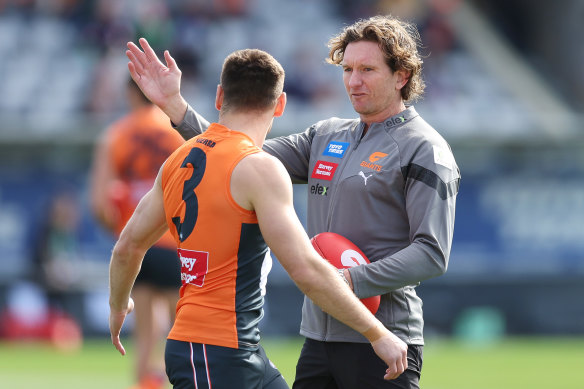 James Hird, chatting with Giants captain Stephen Coniglio, was back in the AFL fold this season.