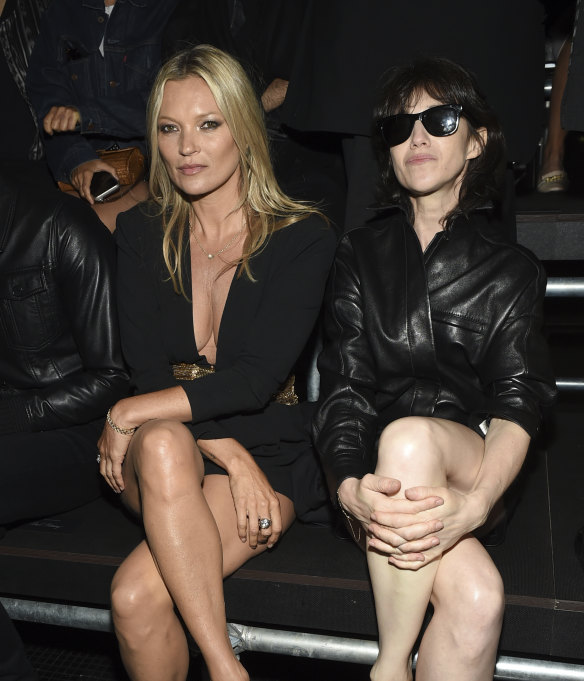 Model Kate Moss, left, and Charlotte Gainsbourg attend a fashion show.
