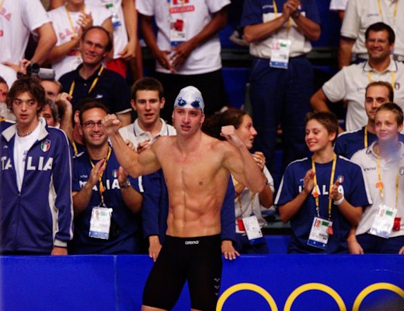 Italy's Massimiliano Rosolino, winner of the final of the men's 200m individual medley, celebrates with the Italian swimming team.