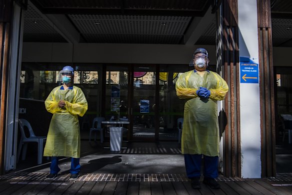 Nurse Krizzaint Aliparo (left) with Nurse Mario await people to arrive for testing.