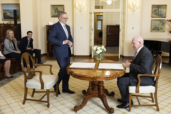 Governor-General David Hurley (right) conducts the swearing-in ceremony.