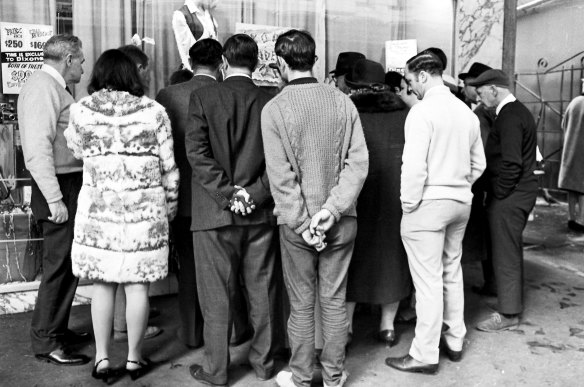 People gather outside Dixons department store in Sydney to watch a live telecast of the moon landing.