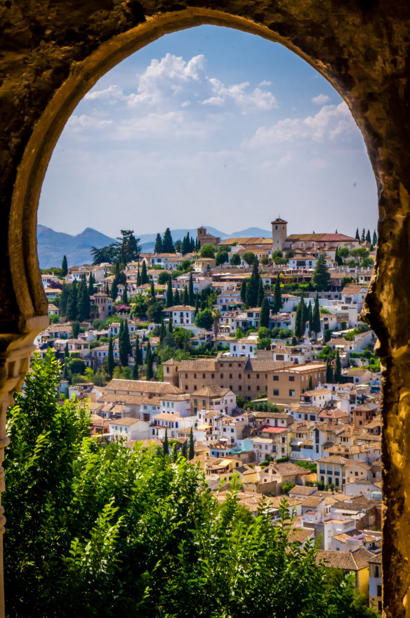 The old town of Granada from a palace arch.