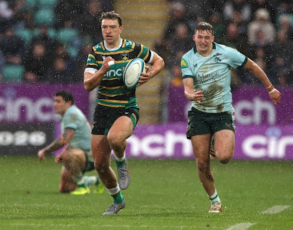 James Ramm of Northampton Saints breaks with the ball during the PREM Rugby Cup match between Northampton Saints and Leicester Tigers.
