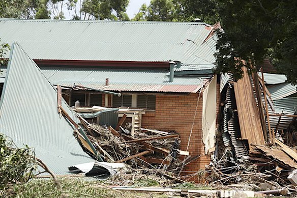 Emergency services search for bodies in the town of Grantham, in the Lockyer Valley, which was devastated by a sudden flood on January 10. Photo: Dean Saffron