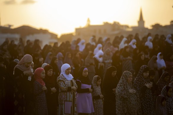 Muslim worshippers offer Eid al-Adha prayer in the mixed Arab Jewish city of Jaffa, near Tel Aviv, Israel.