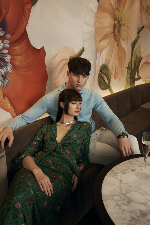 Bela wears Scanlan Theodore dress, $850, and Arms of Eve “Odette” necklace, $120, and “Sophia” snake chain, $95. Zane wears Orlebar Brown top, $745, and pants, $350, and Omega watch, $17,675.