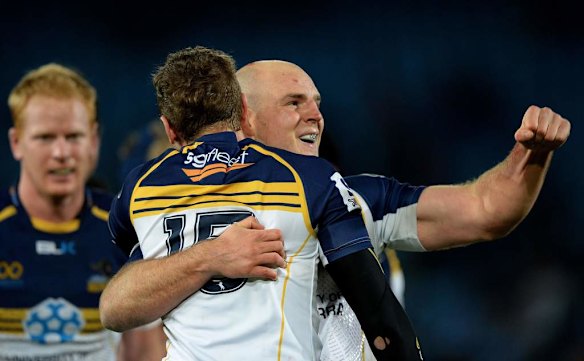 Stephen Moore of the Brumbies celebrates with Jesse Mogg after the Brumbies' victory.