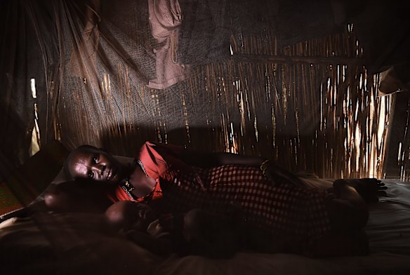 Martha Nyambol, 28, with her 7 month old baby Nyall Koang in her shelter inside the UN Bentiu Protection of Civilians (POC) site, Bentiu, Unity State, South Sudan. 