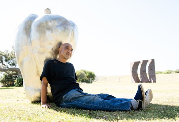Eiji Hayakawa with his work, 'Paprika', at Sculpture by the Sea, in Sydney. 