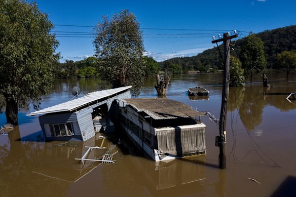 Dargle Water ski resort still inundated after the Hawkesbury River flooded through on Sunday. Several of the caravans were washed downstream and dumped at St George Caravan Park.