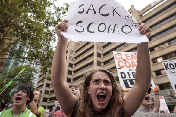 Protesters chanted, "Hey hey, ho ho ScoMo has got to go" as speakers climbed Town Hall’s side steps, and later moved on to "The liar from the shire, the country is on fire".