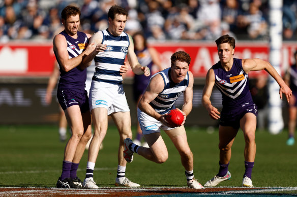 Heat of the battle: Geelong’s Gary Rohan looks to break free against the Dockers.