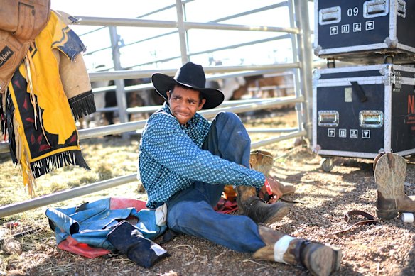 Dwayne Pott prepares to compete in the junior steer ride event at the Mount Isa Mines Rodeo.