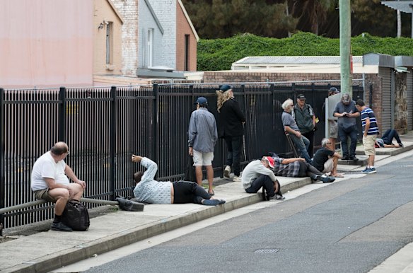 People line up for free lunch at Matthew Talbot Hostel in Woolloomooloo, Sydney. April 2, 2020