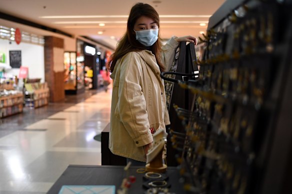 Lockdown affecting retailers in Chatswood. Pop-up jeweller Sabrina Zhang with her unsold jewellery at Westfield on Sunday.