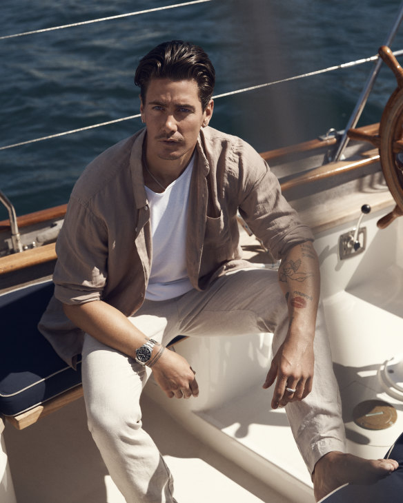 He wears French Connection linen shirt, $100;  Bassike “Heritage” tank top, $90, and linen trousers, $360; and Rolex “Submariner 
Date 41” watch, $12,900. 