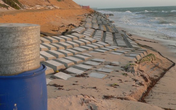 Temporary reinforcing works on the beach quickly lost their covering of sand, creating an even more hazardous environment.