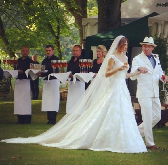 Guy Ritchie and Jacqui Ainsley married in front of celebrity friends like David Beckham, Henry Cavill and Armie Hammer at their country home in Wiltshire, England, in July.